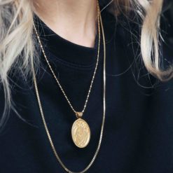 Faces necklace gold from the Venus collection from Hasla. Norwegian Jewelry design.