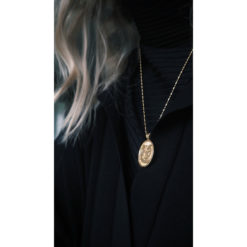 Lovers necklace gold from the Faces collection from Hasla. Norwegian Jewelry design.